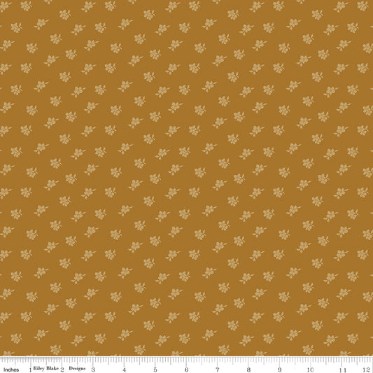 Brown fabric with scattered blossoms.