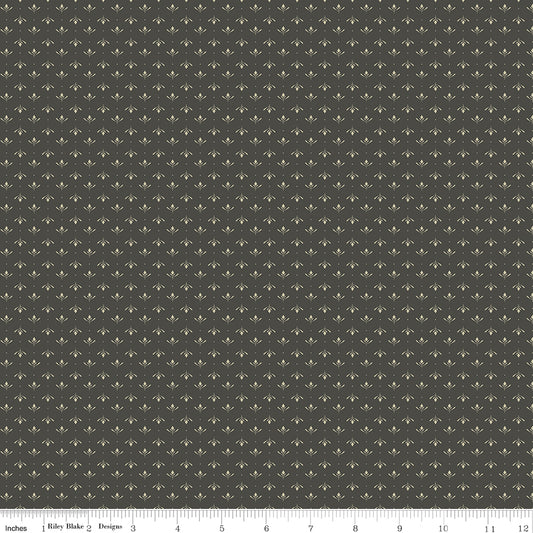 Gray fabric with an array of blossoms and pin dots.