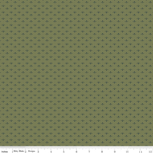 Green fabric with an array of blossoms and pin dots.