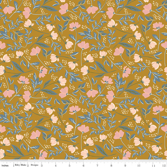 Orange fabric with sprigs of flowers and leaves with X's and O's.