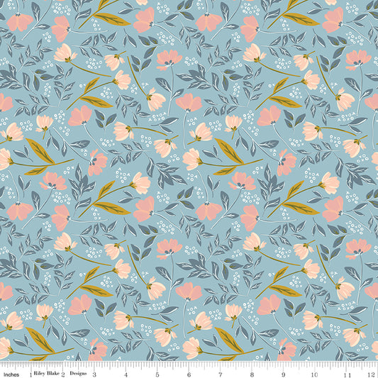 Blue fabric with sprigs of flowers and leaves with X's and O's.