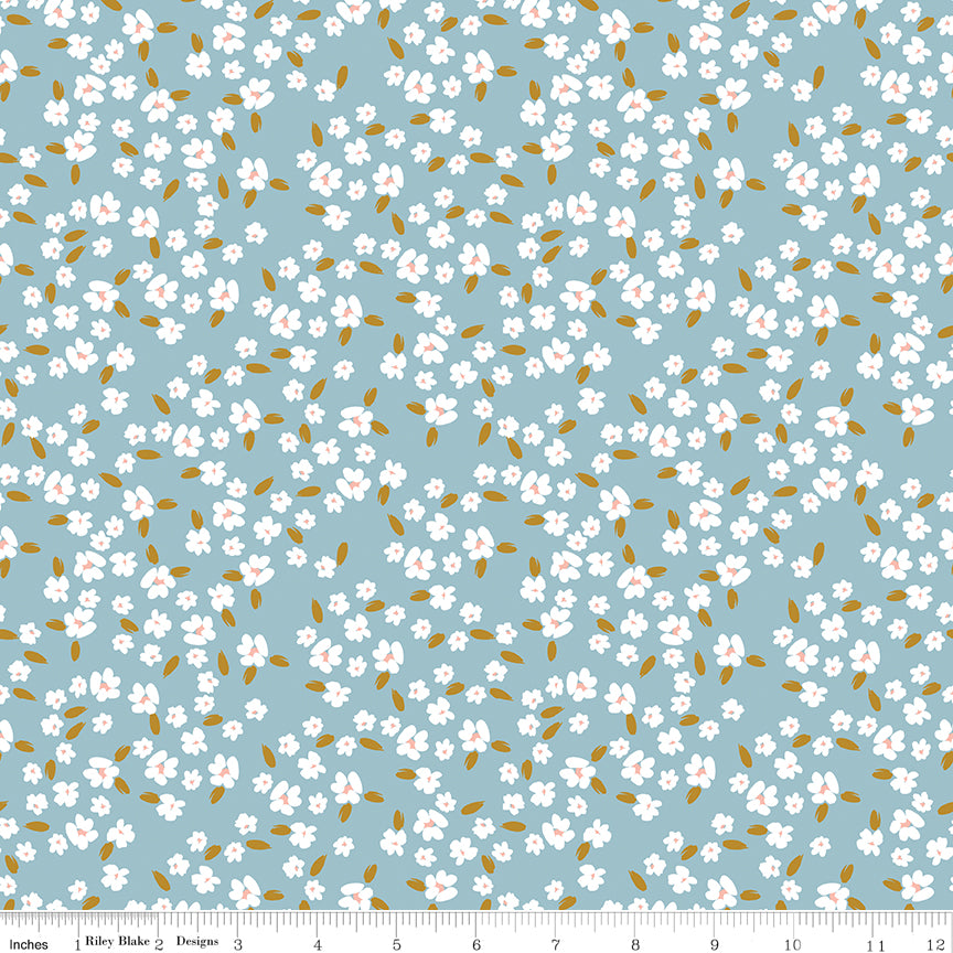 Blue fabric with white blossoms.