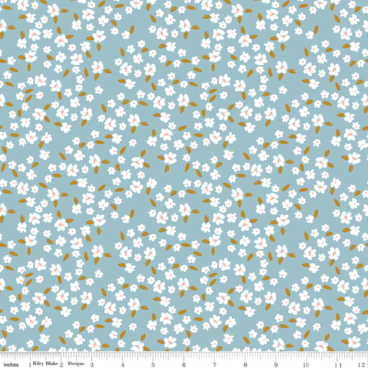 Blue fabric with white blossoms.