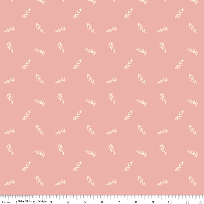 Coral fabric with scattered leaves.