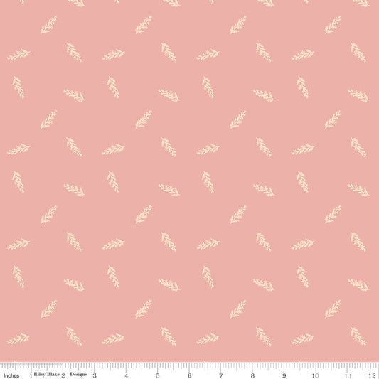 Coral fabric with scattered leaves.