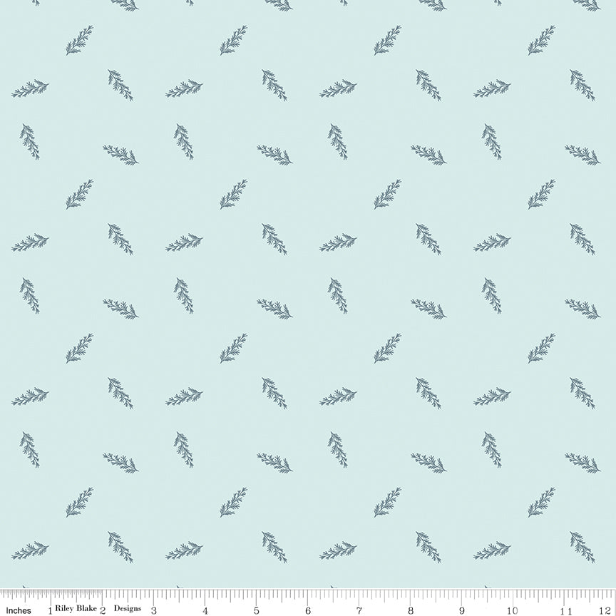 Blue fabric with scattered leaves.