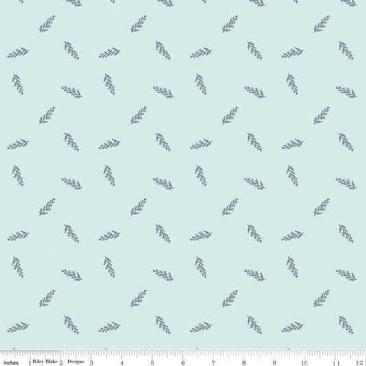 Blue fabric with scattered leaves.