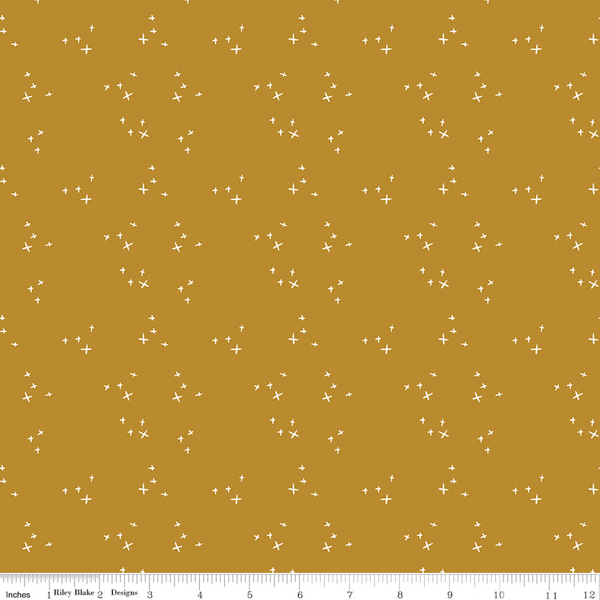 Orange fabric with scattered X's.