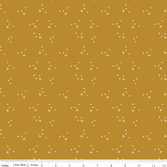 Orange fabric with scattered X's.