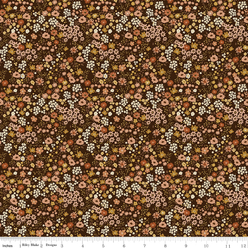 Dark coffee brown quilting cotton fabric with an all-over meadow floral print in blush pink, coral, cream, and golden green. Worth Repeating by Sandy Gervais for Riley Blake Designs