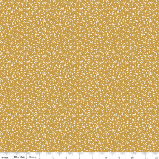Golden mustard quilting cotton fabric with an all-over tiny ditsy floral and leaf print in cream. Worth Repeating by Sandy Gervais for Riley Blake Designs.