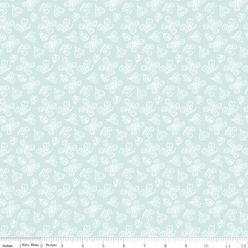Aqua fabric with outlined butterflies, moths and ladybugs.