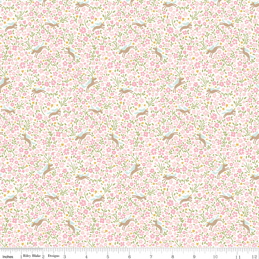 Pink fabric with unicorns surrounded by flowers.