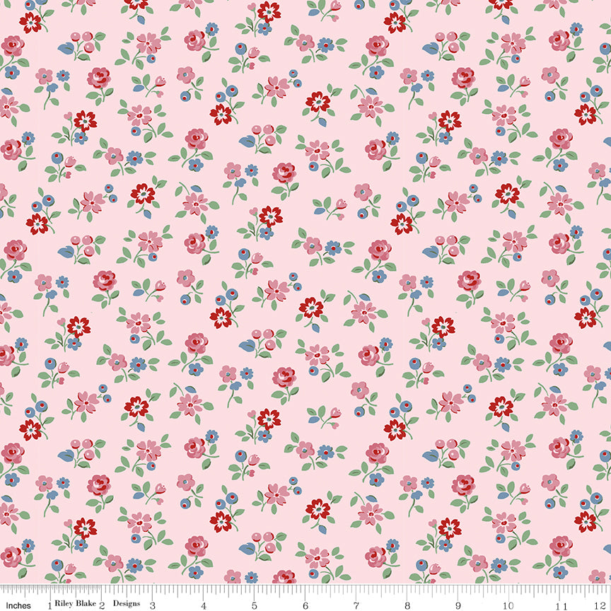  This print features sprigs of flowers and leaves on a pale pink background.
