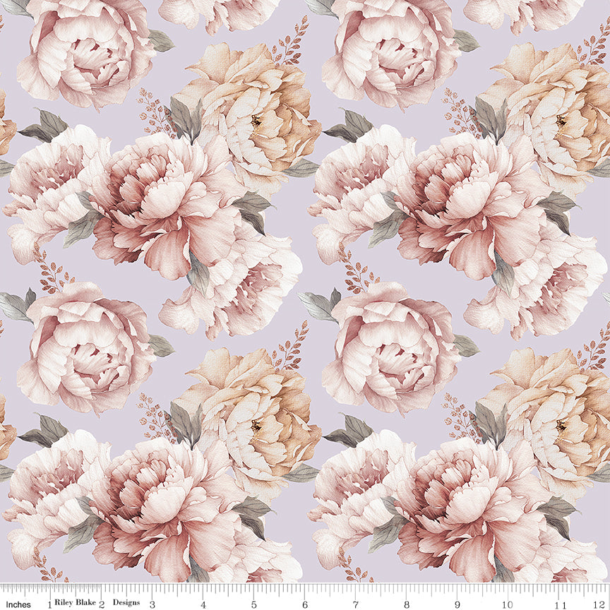 A repeating floral pattern featuring large blush pink and cream peony-like flowers with muted green leaves on a light lavender background, with a small ruler edge visible along the bottom.
