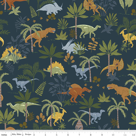 Flannel Cretaceous Jungle Dinos Navy by Riley Blake Designs — dinosaur print on navy cotton flannel, shown with ruler for scale
