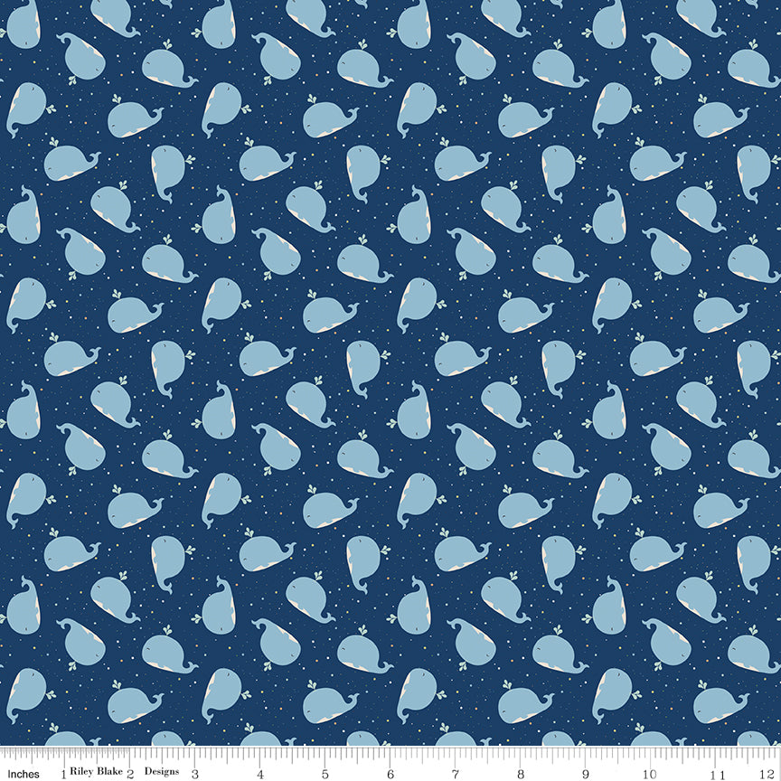 Love You to the Moon Whales Navy flannel by Echo Park for Riley Blake Designs — cotton flannel with whales on a navy speckled background, shown with ruler for scale