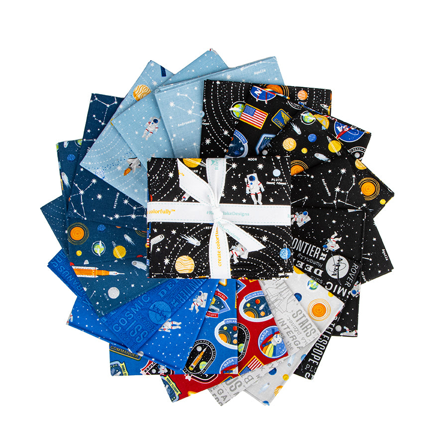 Reach for the Stars with NASA fat quarters fanned out, showing the space prints.