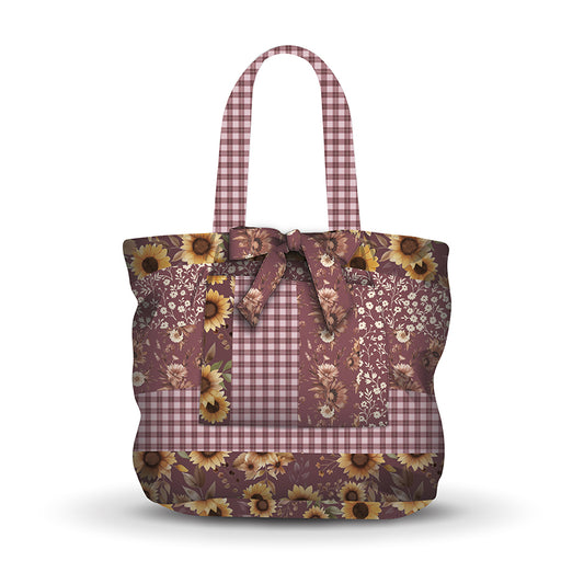 Tote bag with floral and plaid pattern on a white background