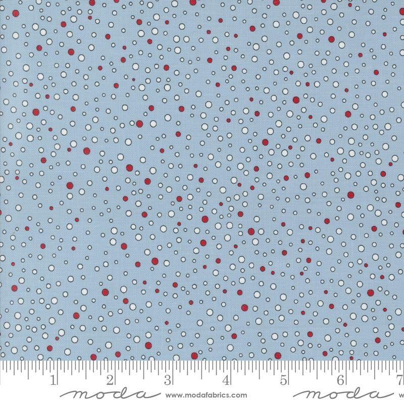 Light blue fabric with white and red circles scattered throughout. 